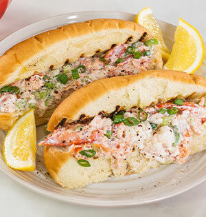Original Nova Scotia Lobster Rolls prepared with Astro Yogurt with lemon wedges on the side.